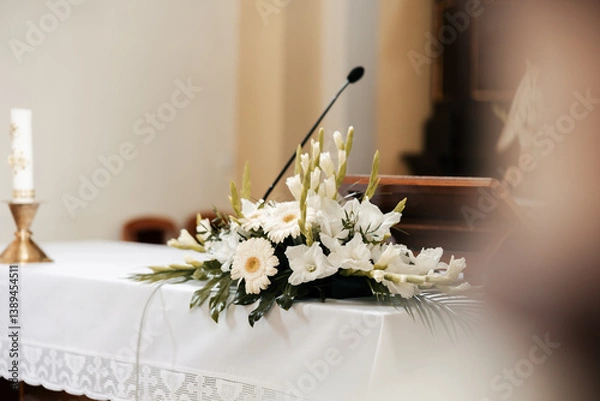 Fototapeta Gracefully adorned with ribbons and blooms, the church whispers elegance. Each detail adds a touch of romance to the sacred space where vows will soon be exchanged.