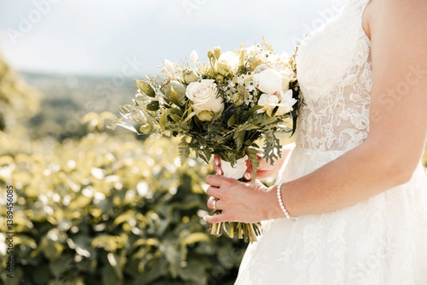 Fototapeta In her hands, a bouquet of love and dreams — each bloom a promise, each petal a step toward forever. A delicate symbol of her journey to this moment. 