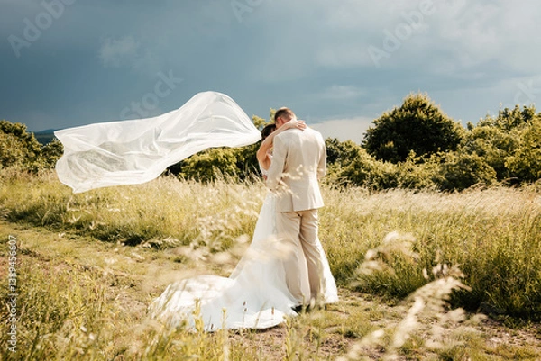 Fototapeta Among the trees, hand in hand, they walk into their forever. Nature surrounds them in silence and peace — a perfect backdrop for the beginning of their love story
