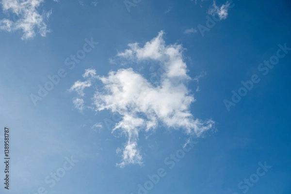 Fototapeta Natural cloudy sky, ornamental clouds, blue sky with light of sunshine having small and large clouds, sky with deep dark clouds and golden. Dense cloudy weather. No AI image, real photo.