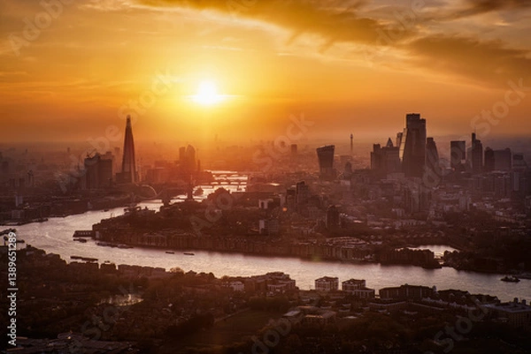 Obraz Panoramic view of the urban London skyline during a colorful summer sunset with clouds and haze, United Kingdom