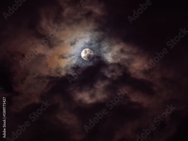 Fototapeta Ethereal Moon Veiled by Crimson-Violet Clouds