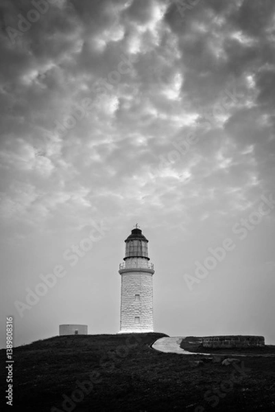 Fototapeta Dongju Lighthouse on the dongju island black and white dramatic sky