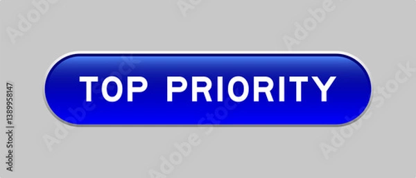 Fototapeta Blue color capsule shape button with word top priority on gray background