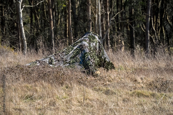 Fototapeta army camouflage netting cover deployed to hide broadcast equipment