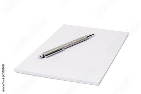 Fototapeta White notepad isolated over white with a ball pen
