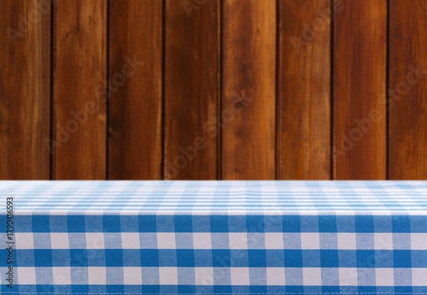 Obraz Empty blue and white checkered tablecloth on wooden background