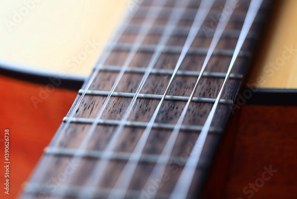Fototapeta A detailed look at the frets on a guitar, ideal for music-related uses.