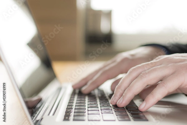 Obraz laptop closeup, chatting in Facebook, meeting website.Typing on laptop, Blogger, journalist writing new article.