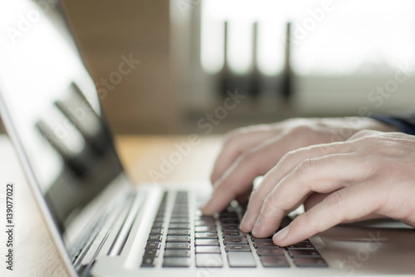 Obraz laptop closeup, chatting in Facebook, meeting website.Typing on laptop, Blogger, journalist writing new article.