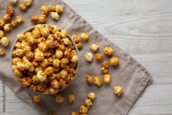 Fototapeta Homemade Caramel Popcorn in a Bowl, top view.