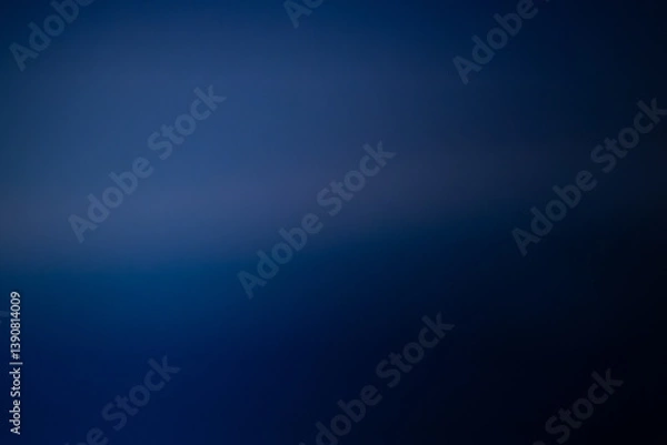Fototapeta A smooth, rich blue gradient background with soft tonal transitions, creating a minimal and professional atmosphere. Includes copy space.