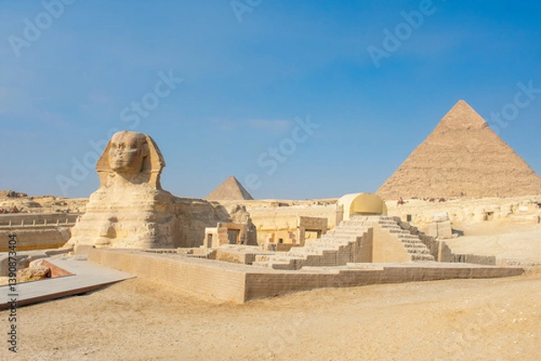 Fototapeta Great Sphinx and Great Pyramid of Cheops, Cairo, Egypt. Ancient statue of Sphinx, mythical creature with head of man and body of a lion, Giza pyramid complex (Giza Necropolis)