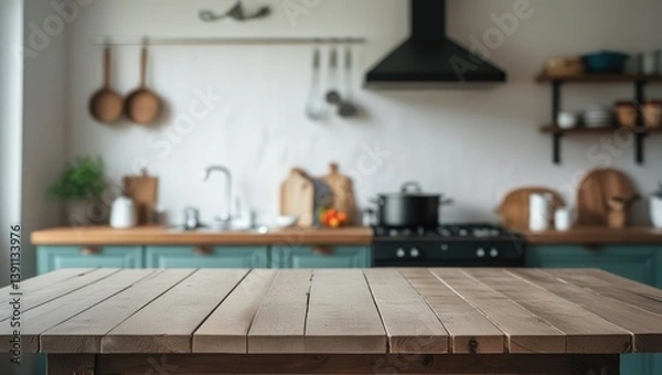 Fototapeta Empty tabletop over defocused kitchen with copy space
