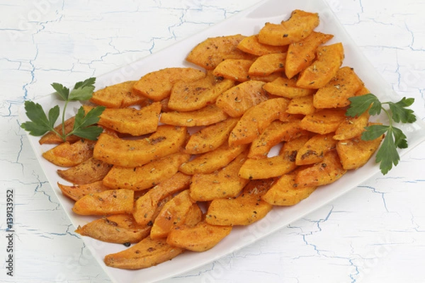 Obraz Butternut slices baked in spicy dressing