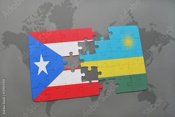 Fototapeta puzzle with the national flag of puerto rico and rwanda on a world map