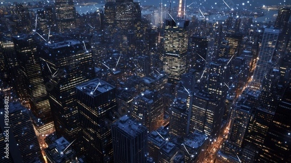 Fototapeta Aerial view of city at night, snow falling, urban lights.  Possible use for stock photography