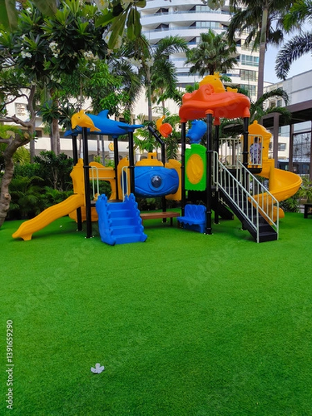 Fototapeta The colorful playground on yard in the park.