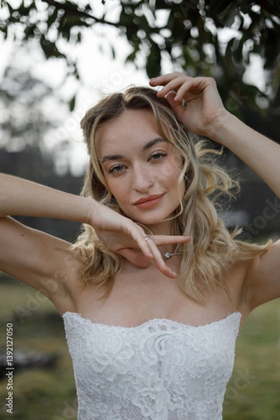 Obraz A Stunning Bride Captured in Nature An Elegant Wedding Portrait Celebrating Love and Joyful Moments