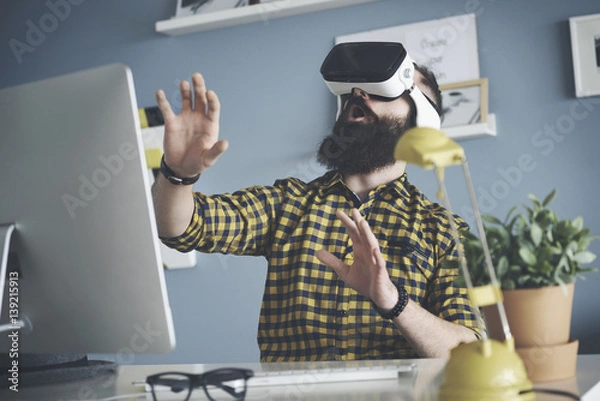 Fototapeta Close up of man wearing virtual reality headset