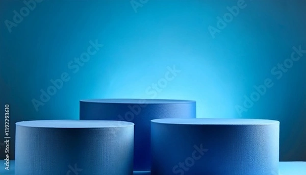 Obraz three blue cylinder podiums against matching background