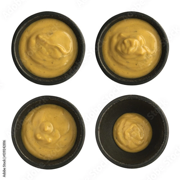 Fototapeta Set of Mustard Sauce in Round Bowls Isolated on White Background