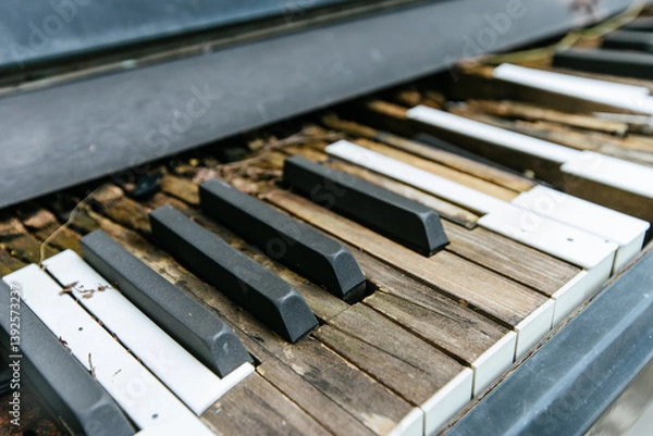 Fototapeta Abandoned piano keys urban setting still life weathered environment close-up artistic concept