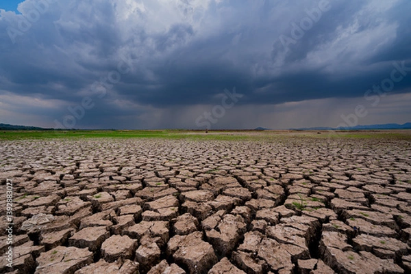 Obraz The parched ground is cracked and the storm is coming.