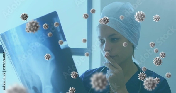Obraz Analyzing X-ray in hospital, medical professional surrounded by virus illustrations
