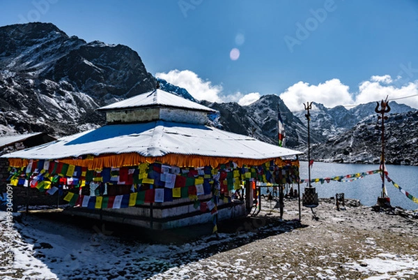 Fototapeta Gosaikunda Lake Hindu Pilgrimage Site with Temple and Prayer Flags in Langtang, Nepal