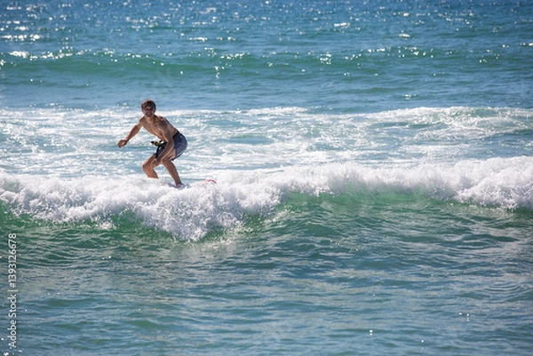 Fototapeta Surfer on low waves