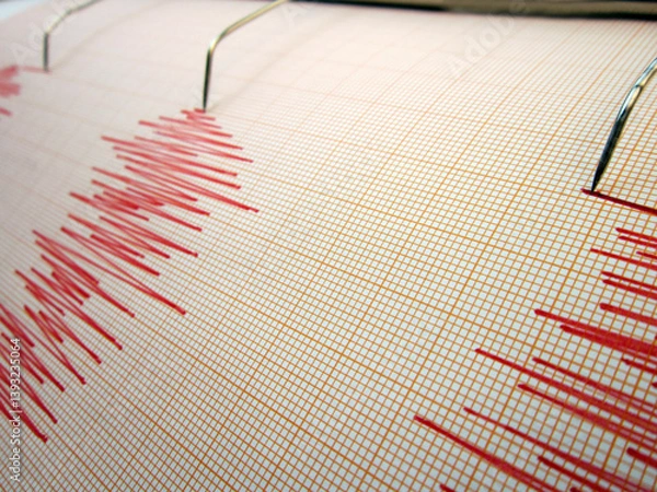Fototapeta Seismograph and earthquake. A seismograph that records the seismic activity of an earthquake.