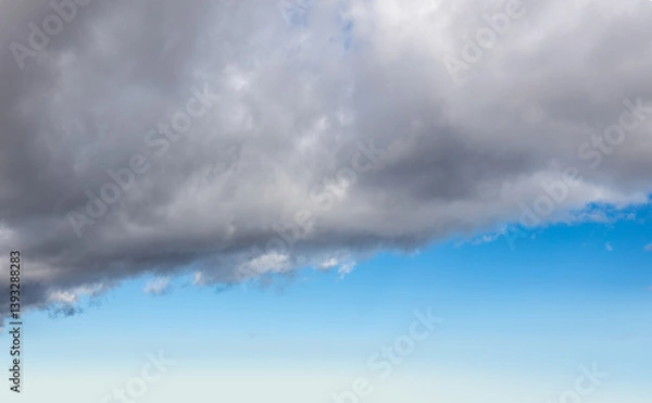 Obraz Blue sky with gray clouds background.