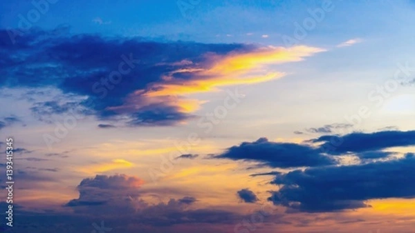 Fototapeta A plane soars through the sky at sunset, with warm hues and clouds in the background