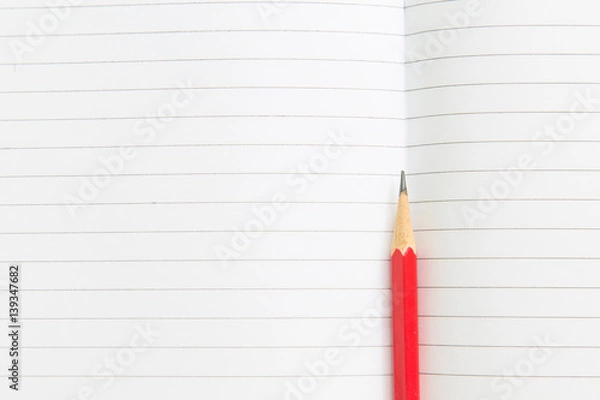 Fototapeta Blank notebook with pencil on wooden table, business concept.