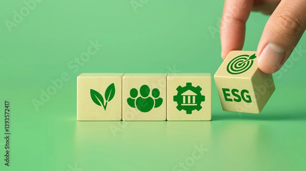 Fototapeta Wooden blocks display icons representing environment, social impact, governance, and ESG goals, symbolizing sustainable business practices and ethical responsibility.