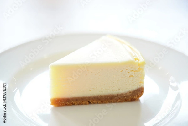 Obraz Minimalist Cheesecake Slice Presentation on White Backdrop