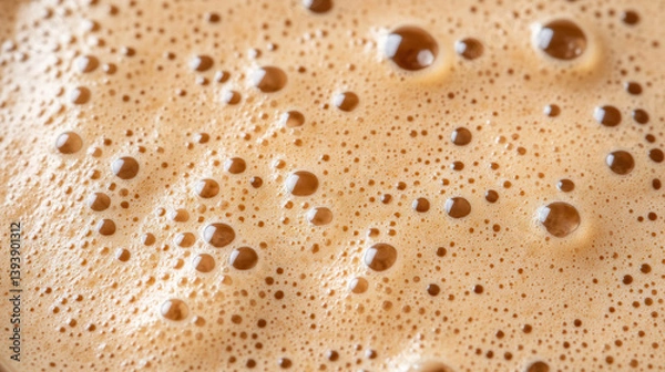 Fototapeta Creamy foam with bubbles creates warm and inviting atmosphere, perfect for cozy drink