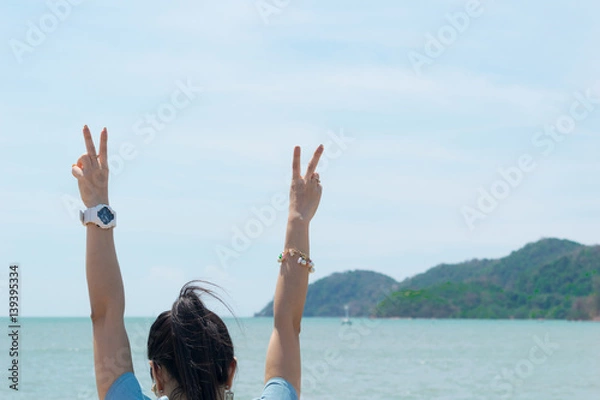 Fototapeta Woman travel hands two fingers Natural background