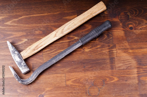Obraz Hammer and nail puller on a table. Old tools