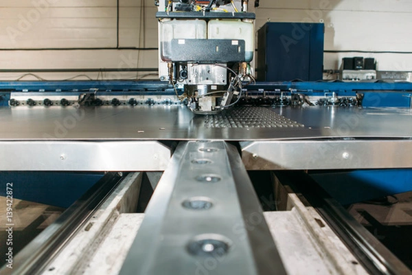 Fototapeta Coordinate punching press machine with metal plate