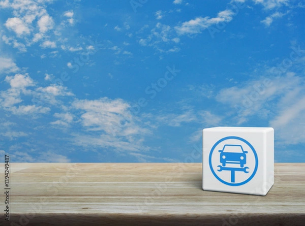 Obraz Service fix car with wrench tool icon on white block cube on wooden table over blue sky with white clouds, Business repair car service concept