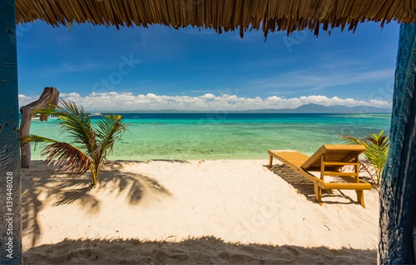 Obraz Beach chairs, clear water and beautiful view on tropical island,