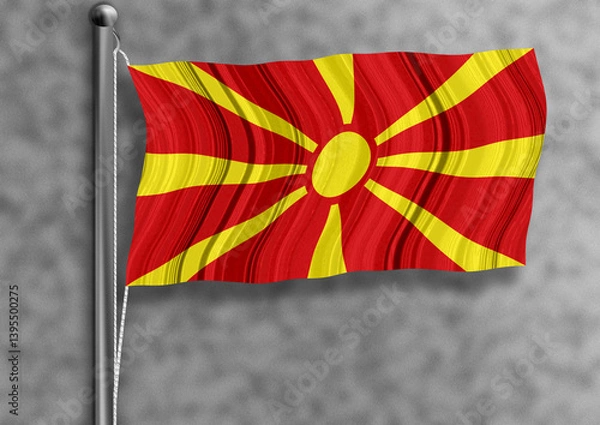 Obraz North Macedonia flag flying on a flagpole, isolated, textured wall in the background.