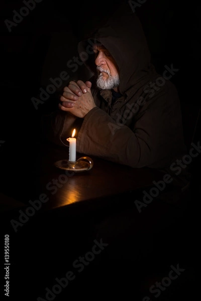 Obraz Mönch im Gebet mit Kerze