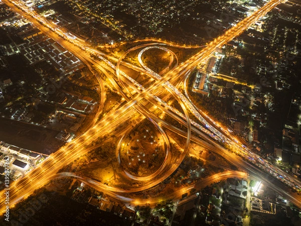 Fototapeta Expressway, Self-driving autonomous electric cars of the future with HUD elements move along a busy traffic intersection. Concept: Artificial Intelligence, Car Scan, GPS Tracking, Smart Roads, IoT.