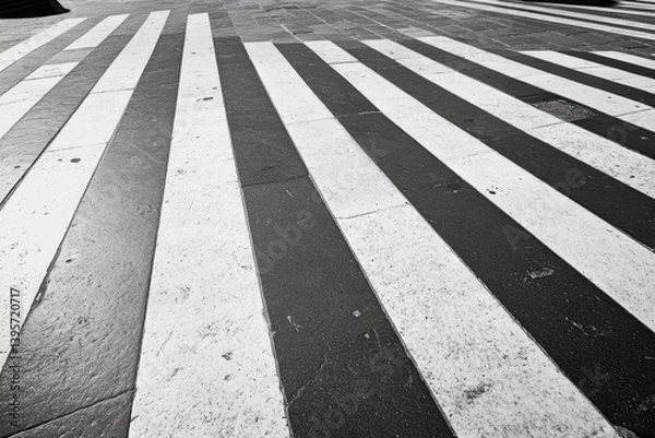 Fototapeta Sunlit shadows play on cafe walls around empty wooden tables, creating a peaceful and inviting urban retreat.