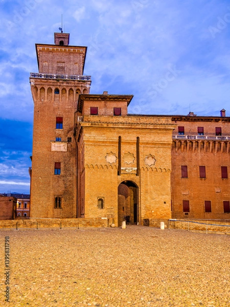 Obraz Castello Estense in Ferrara, Italy, during twilight, viewed from the Castello Piazzetta and highlighting the entrance through the south gate.