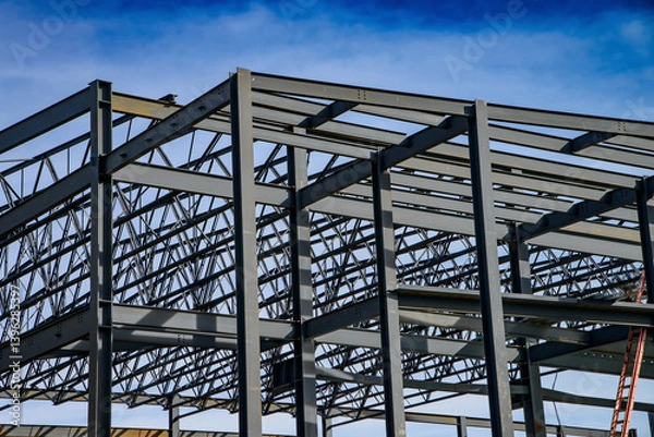 Fototapeta Steel framework assembled for new commercial building under construction.