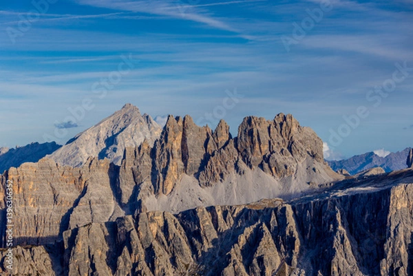 Fototapeta Dolomites, Alpi Dolomiti beautiful scenic mountain landscape under blue sky in summer. Rocky tower peak summits of the Alps on a sunny day. Alpine scenic view of the cliffs and climbing walls in Italy